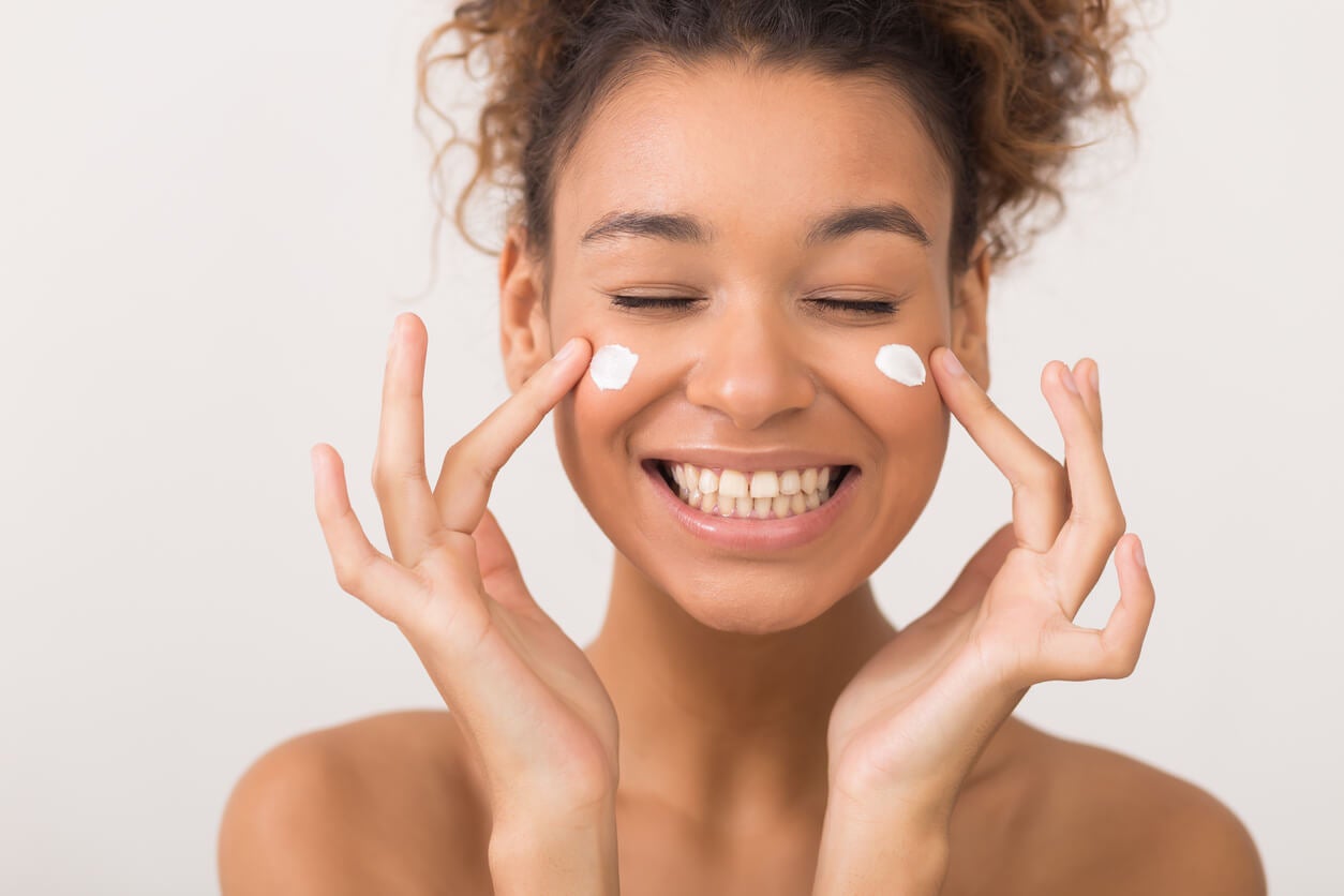 woman-applying-face-cream